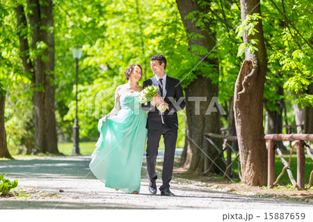 Wedding couple walking in park. Wedding couple walking in park. 15887659