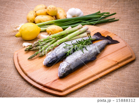 Two raw trout with green asparagus, lemon Two raw trout with green asparagus, lemon 15888312