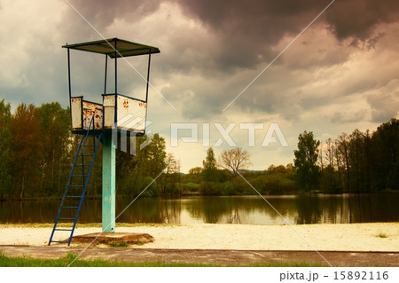 An old white and rusty metal lifeguard tower  15892116