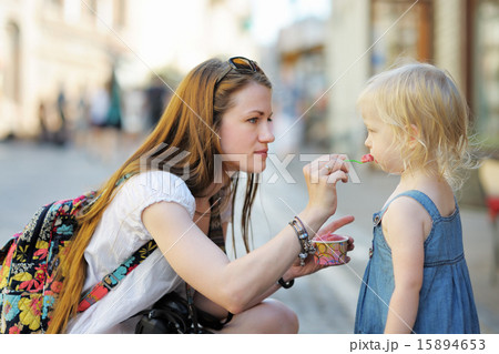 Mother and her daughter eating ice cream 15894653