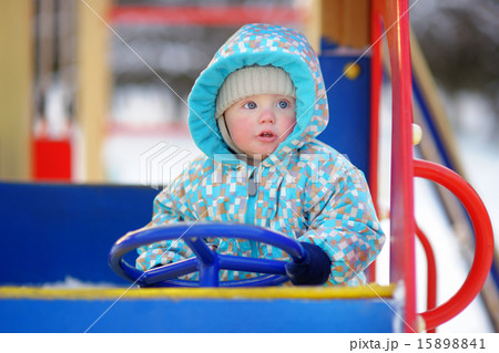 Beautiful toddler boy having fun on playground Beautiful toddler boy having fun on playground 15898841