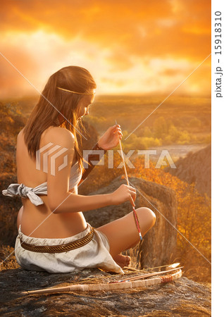 Primitive woman holding a bow and arrow. Amazon woman Primitive woman holding a bow and arrow. Amazon woman 15918310