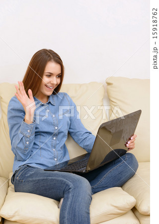 Girl skyping on laptop. 15918762