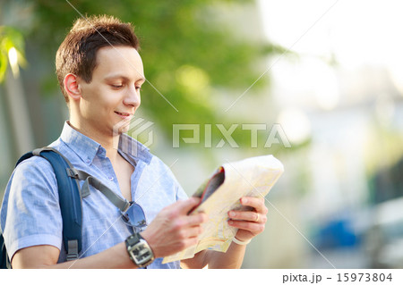 Young man with map Young man with map 15973804