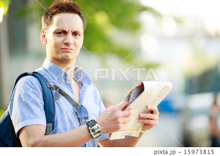 Young man with map Young man with map 15973815