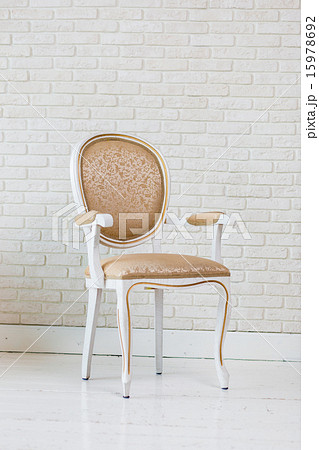 Luxury Golden Vintage Chair On Brick Wall Luxury Golden Vintage Chair On Brick Wall 15978692