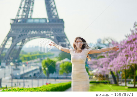 Beautiful young woman near the Eiffel tower Beautiful young woman near the Eiffel tower 15978971
