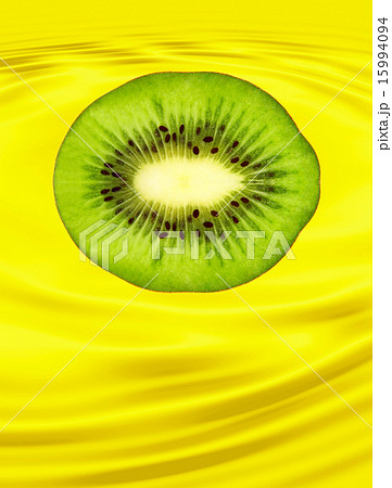 Slice of ripe kiwi on yellow background. Slice of ripe kiwi on yellow background. 15994094