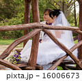 Couple love bride and groom posing sitting on wood 16006673