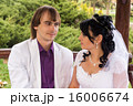 Couple love bride and groom posing sitting on wood 16006674
