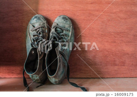 sneakers at wooden wall. sneakers at wooden wall. 16009175