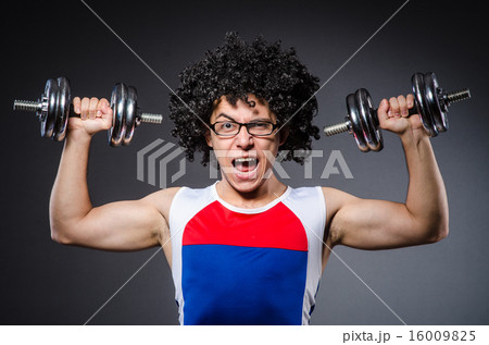 Funny man exercising with dumbbells 16009825