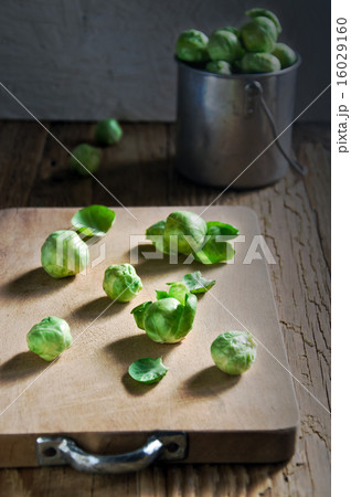 Still life of fresh green Brussels sprouts in a me 16029160