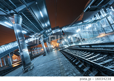 Railway station at night. Train platform in fog 16034238