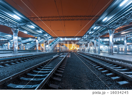 Railway station at night. Train platform in fog 16034245