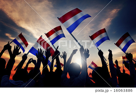 Silhouettes of People Holding Flag of Netherlands 16063886