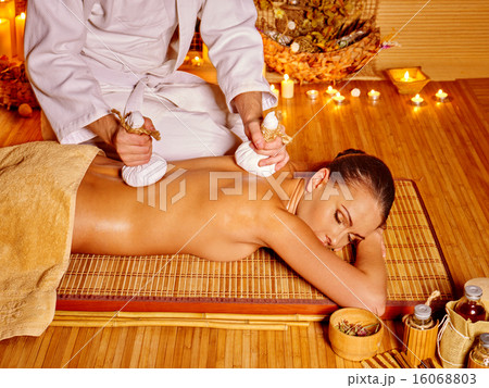 Woman getting massage in bamboo spa. Woman getting massage in bamboo spa. 16068803