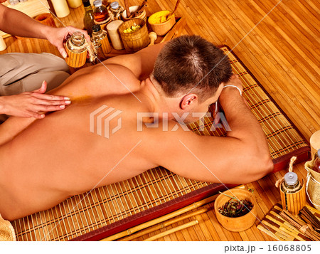 Man getting bamboo massage. Man getting bamboo massage. 16068805
