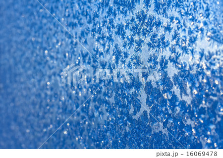 Snowflakes and ice on frozen window Snowflakes and ice on frozen window 16069478