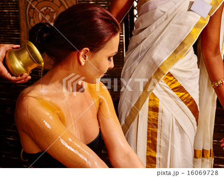 Woman having ayurveda spa treatment. Woman having ayurveda spa treatment. 16069728