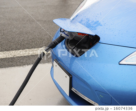Electric car in charging battery at station 16074336