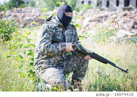Military camouflage with a rifle 16074410