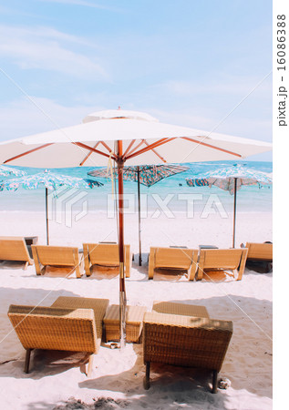 Beach chair and umbrella on tropical sand beach Beach chair and umbrella on tropical sand beach 16086388