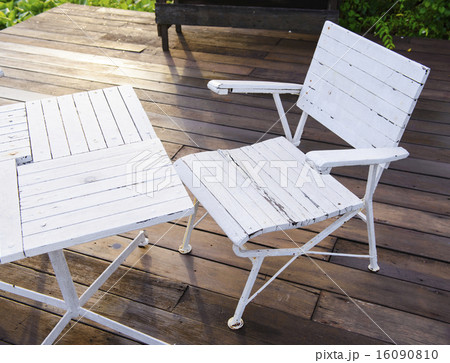 Empty white garden chair and table 16090810