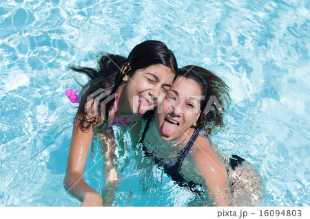 Mother And Daughter Sticking Tongue Out 16094803
