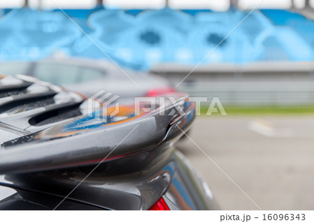 close up of car spoiler on speedway at stadium 16096343