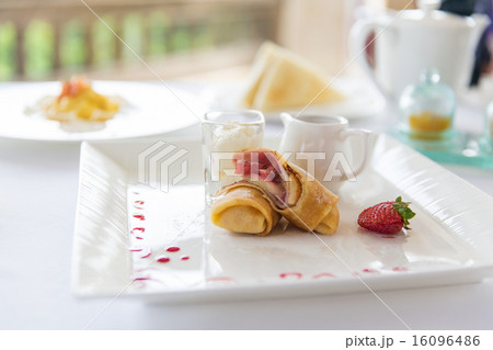 close up of pancakes and honey or jam on plate 16096486