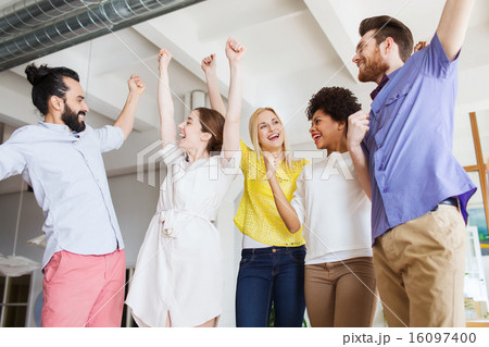 happy creative team in office 16097400