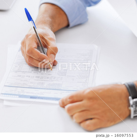 man filling tax form man filling tax form 16097553