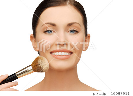 woman applying powder foundation with brush woman applying powder foundation with brush 16097911