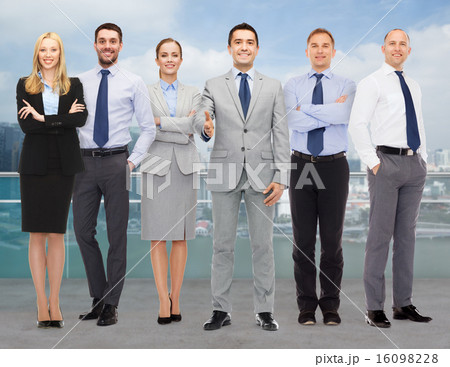 group of smiling businessmen making handshake 16098228