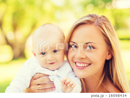 close up of happy mother with little baby in park close up of happy mother with little baby in park 16098434