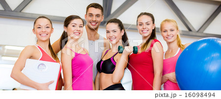group of smiling people in the gym 16098494