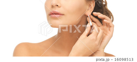 woman wearing shiny diamond earrings woman wearing shiny diamond earrings 16098513