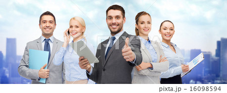 group of smiling businessmen showing thumbs up group of smiling businessmen showing thumbs up 16098594
