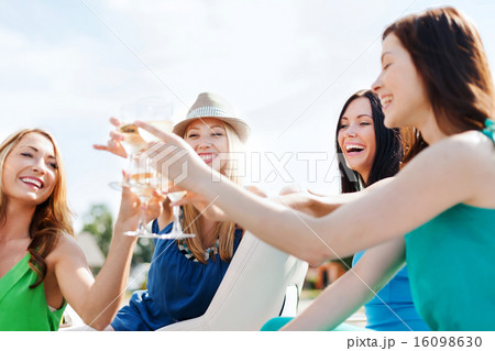 girls with champagne glasses on boat 16098630