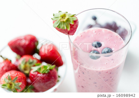 close up of milkshake decorated with strawberry close up of milkshake decorated with strawberry 16098942