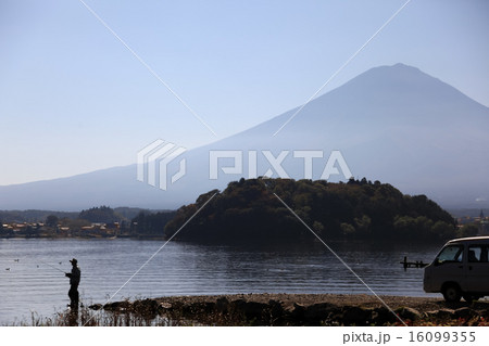 Silhouetted fishing man 16099355
