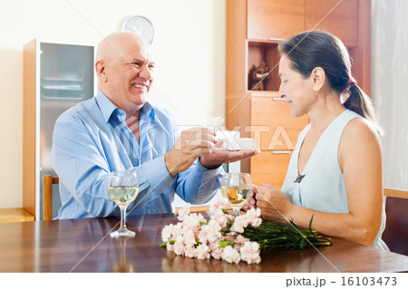 Mature man giving woman the jewel 16103473