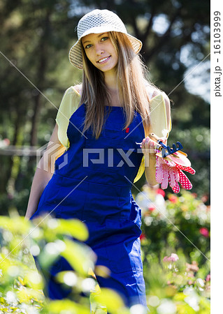 Smiling female gardener in uniform 16103999