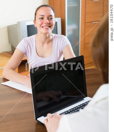 Woman and employee with laptop 16104470