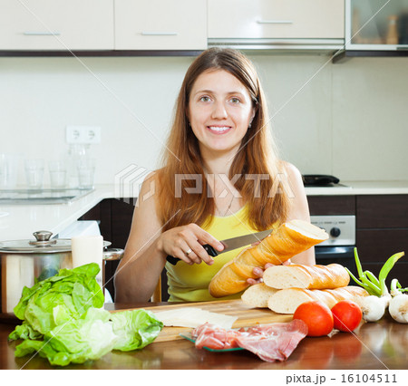Happy girl cooking sandwiches Happy girl cooking sandwiches 16104511