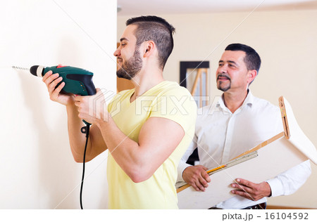 Two skilled men doing maintenance Two skilled men doing maintenance 16104592