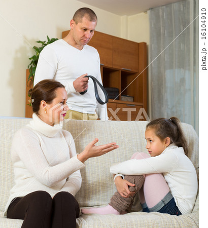 Parents scolding daughter at home Parents scolding daughter at home 16104910