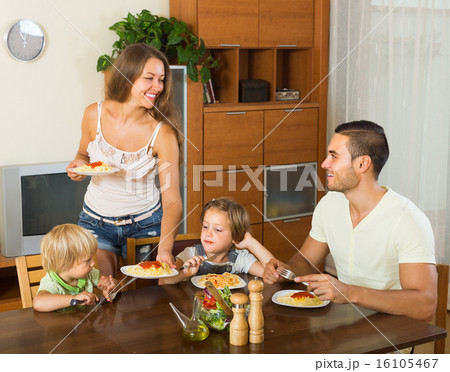Family eating spaghetti 16105467