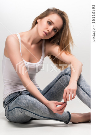 Pretty sad woman on floor 16113593